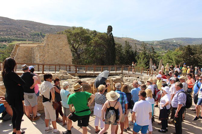 Crete Minoan Discovery Tour with Knossos Palace, Heraklion, and Live Dance Show - Entering Knossos Palace: Big Ruins, Real Atmosphere