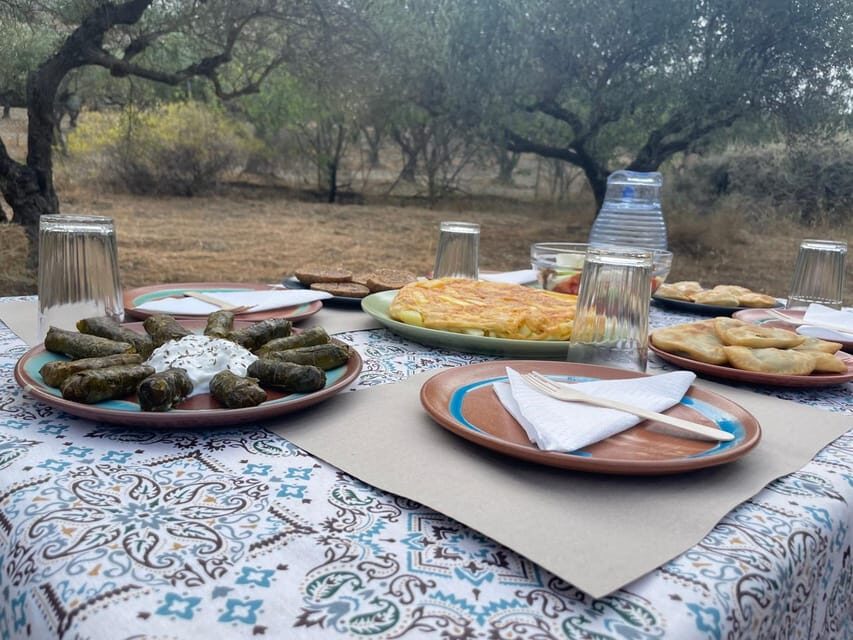 Heraklion: Cretan Farmers Brunch and Olive Grove Tour - The Table Setting: Outdoors, Under Trees, or Covered