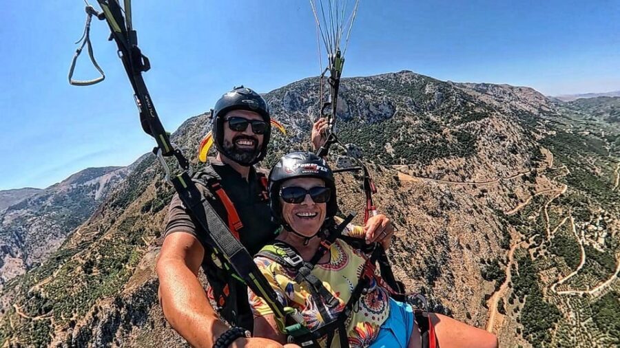 Paragliding in Chania - Pre-flight safety: helmets, communication, and a pro crew